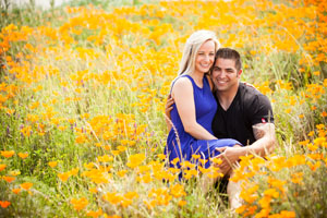 both looking at the camera in a poppy field