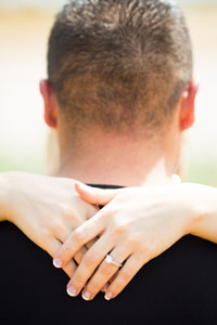 engagement ring shown around his neck