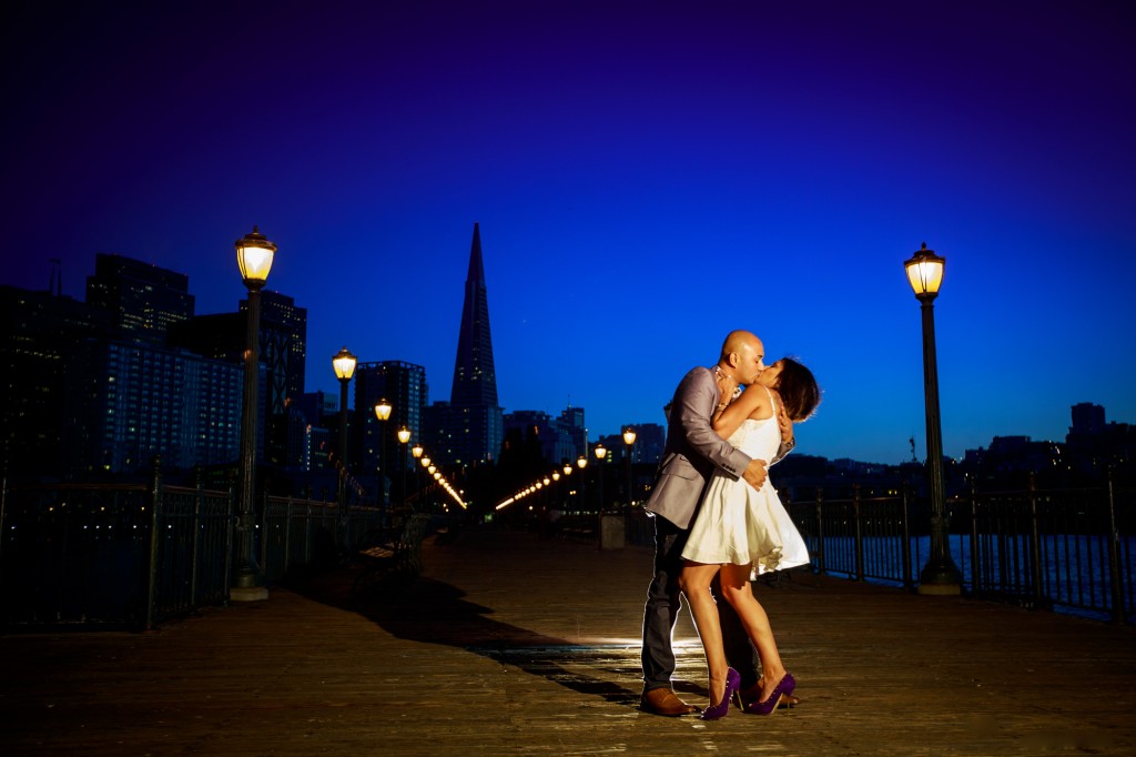 San Francisco Bay pier engagement kiss