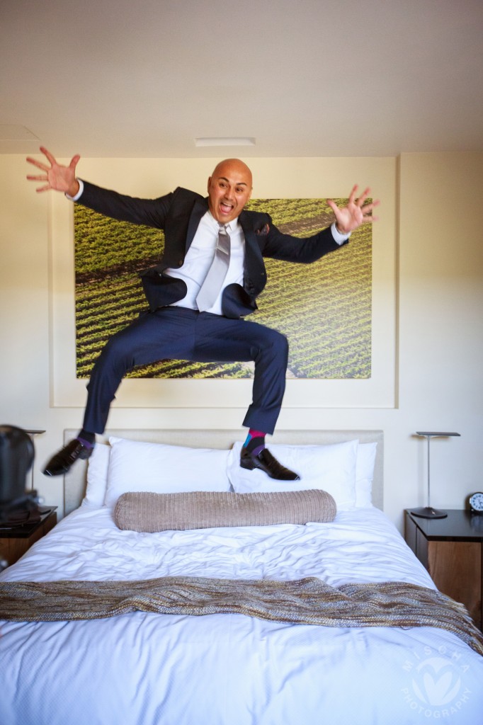 groom jumping on the bed
