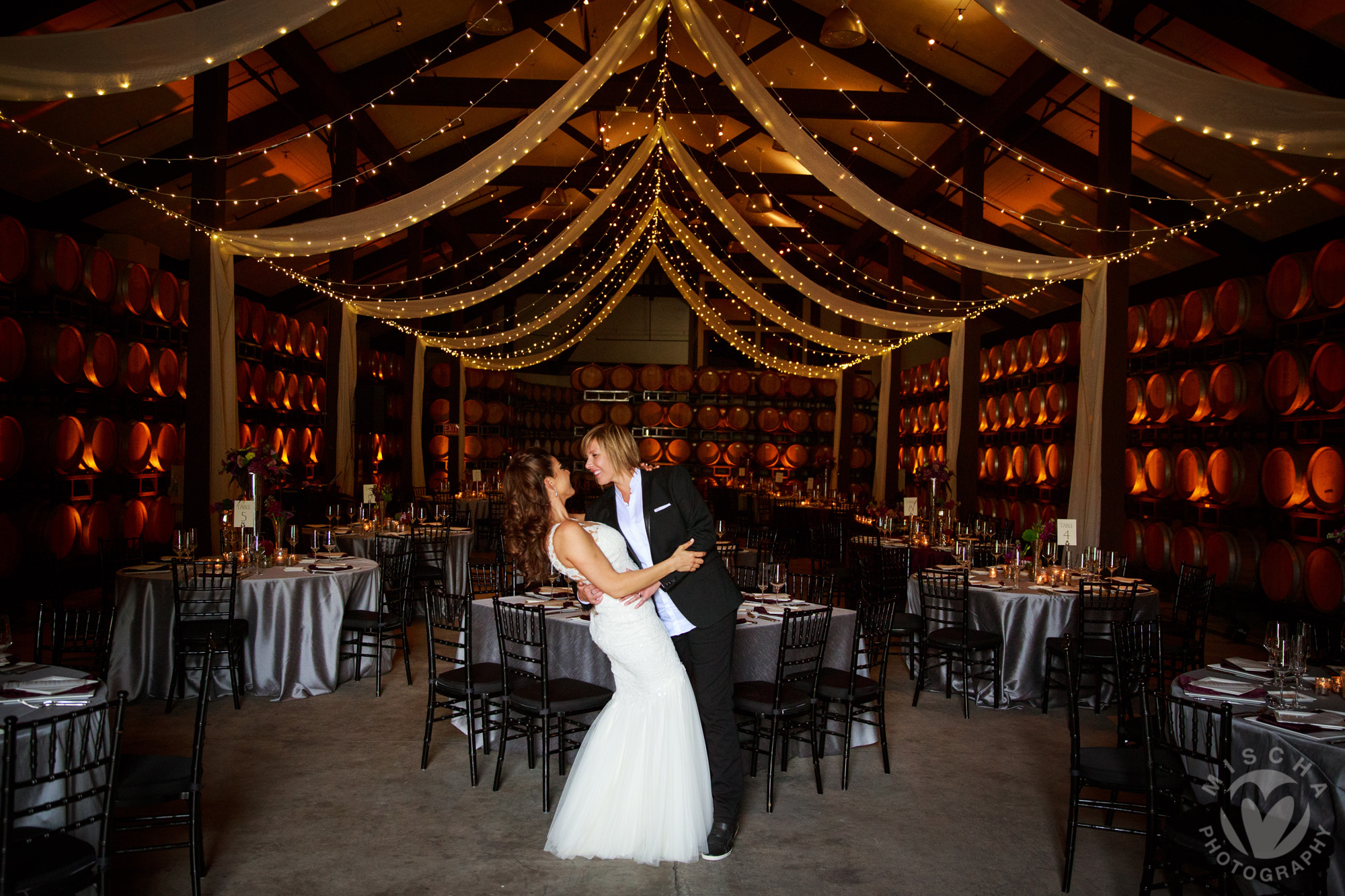Folktale winery barrel room reception - dipping brides